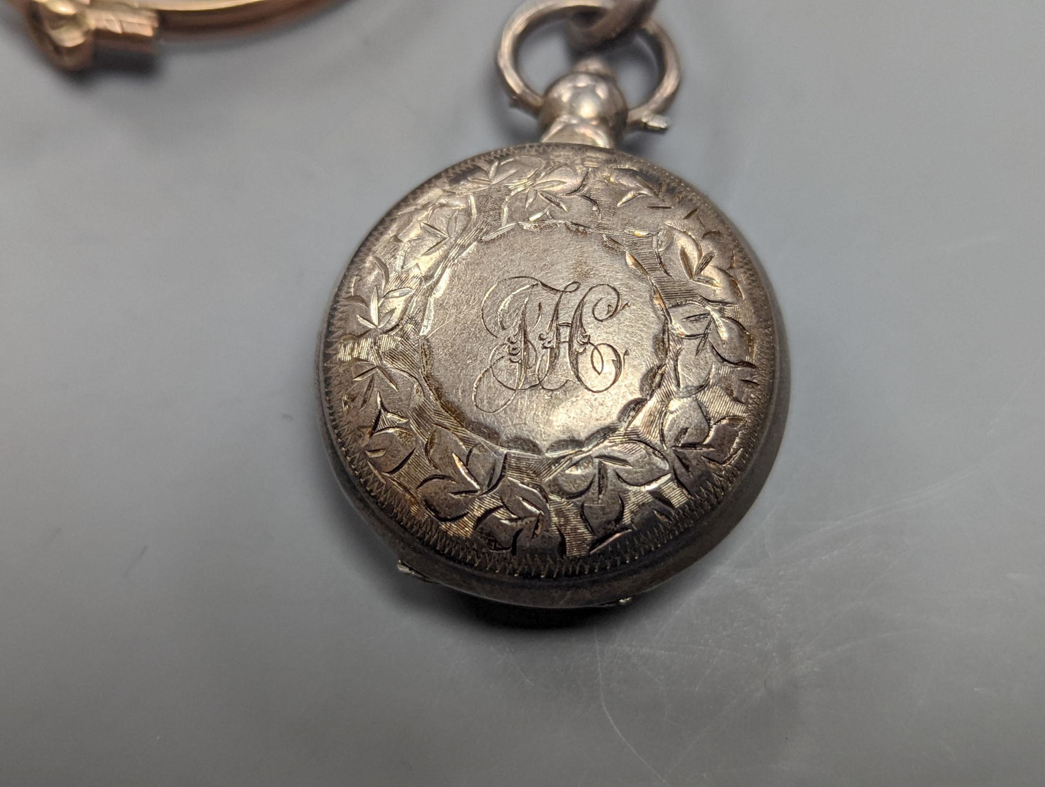 A George V engraved silver sovereign case, Birmingham, 1910, 29mm and a pair of gold plated lorgnettes.